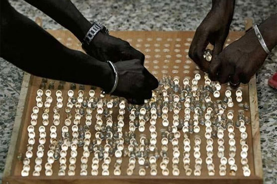 Gambia vote a roll of the marbles