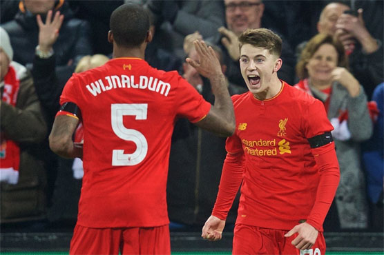 Football: Woodburn makes history as Liverpool reach League Cup semis