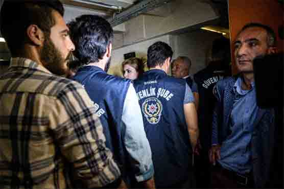 Turkey suspends 12,800 police, shuts TV channel