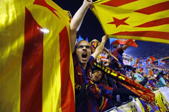 Barca fans defy UEFA with Catalan flag protest