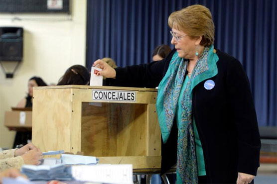 Chile's president forgets to sign name at voting booth, leaves behind ID