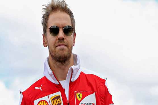 Vettel hands Ferrari boost, Hamilton edges Rosberg