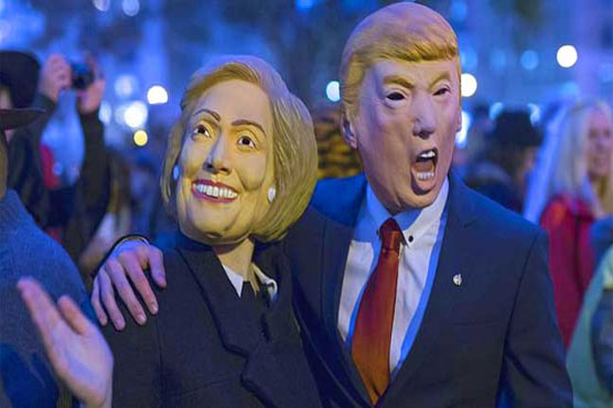 Clinton embraces Trump in grisly Japan Halloween