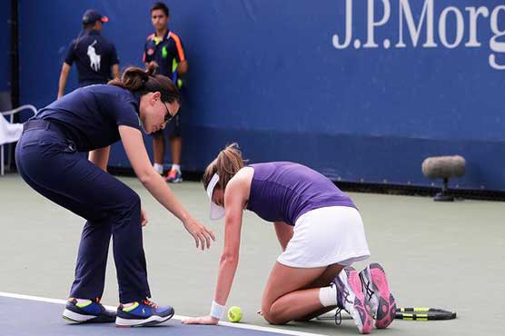 Konta goes through in US Open despite heat illness