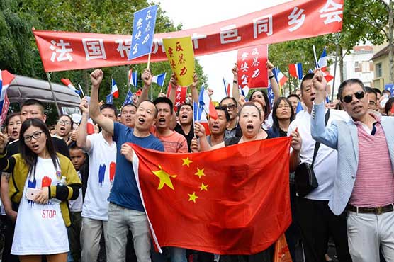 Ethnic Chinese demand security for all in Paris protest