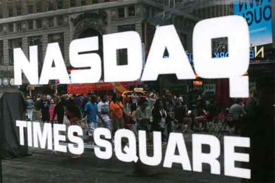 Nasdaq hits record as Fed keeps rates low