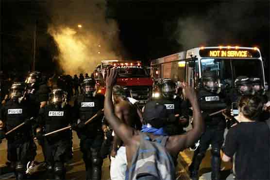 12 officers hurt in N Carolina protests after fatal police shooting