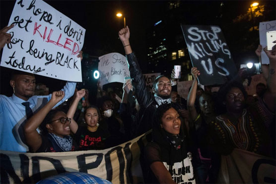Third night of protests in US city amid heavy security