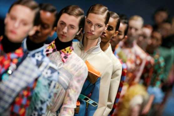 Feathers and nostalgia add glam to Prada spring collection