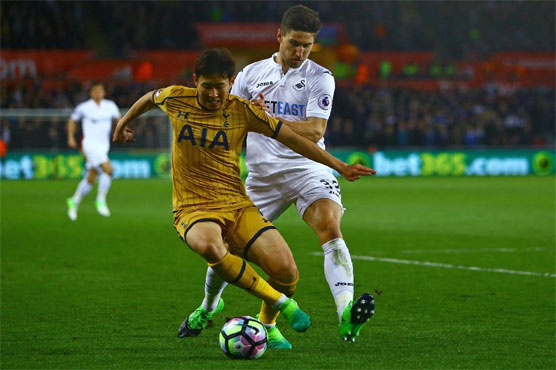 Football: Spurs' thrilling fightback keeps title hopes alive