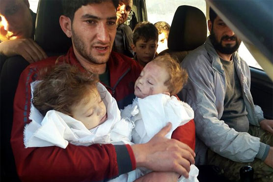 A father bids farewell to twin toddlers after Syria chemical attack