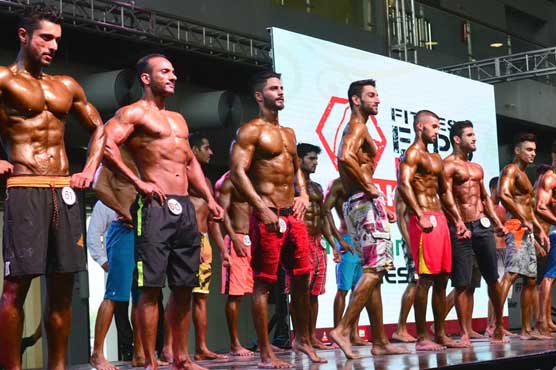 National Bodybuilders pose before Kai Greene in Lahore