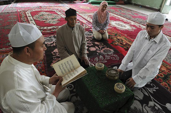 Chinese official says Xinjiang's Muslims are 'happiest in world'