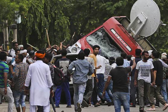 Clashes kill 28 in India as court convicts guru of rape