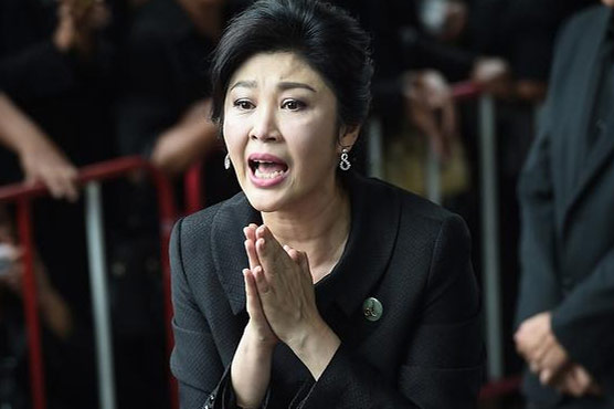 Thai ex-PM flees country on key court hearing, arrest warrant issued