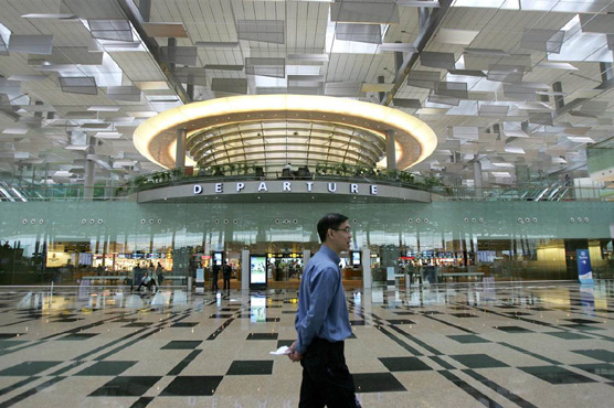 Robots at your service, passengers relax while waiting at Singapore's airport 