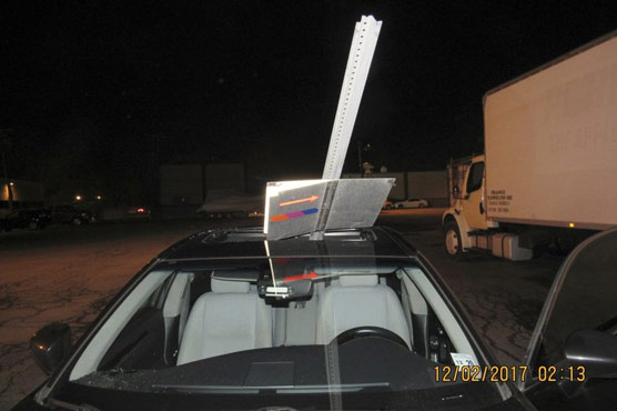 Woman driving with transit sign sticking out of car gets pulled over