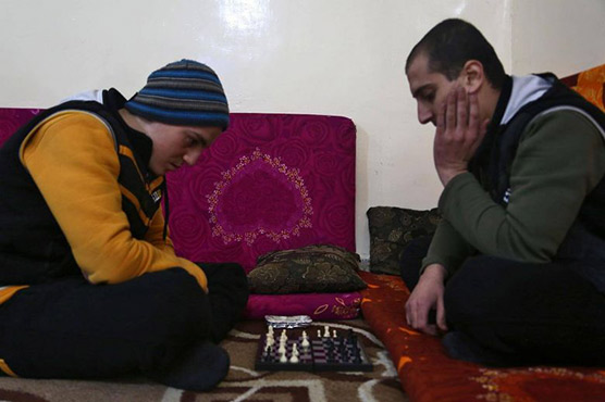 Chess, smokes, therapy for ex-militants at Syria rehab centre
