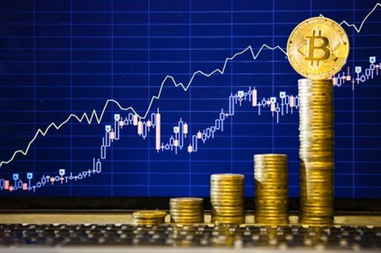 Bitcoin hits new record high as warnings grow louder