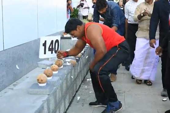 Indian man sets new record by breaking open coconuts with his hand