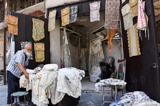Tablecloth shop makes solitary comeback amidst Aleppo rubble