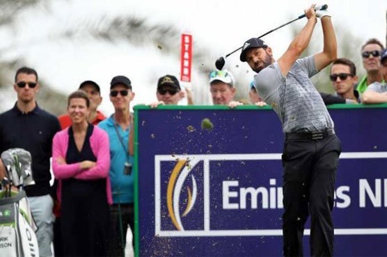 Golf: Garcia leads, Woods struggles in Dubai