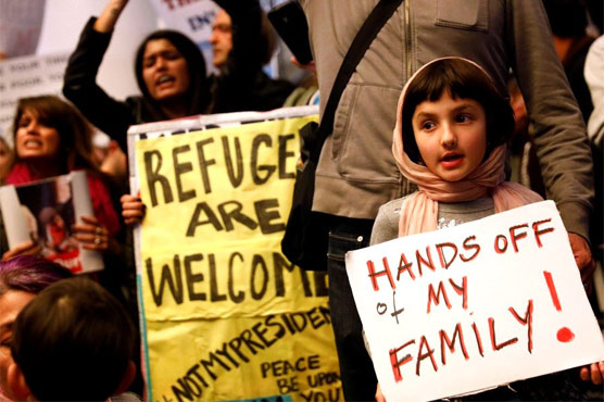 Police arrest 20 Jewish clerics protesting Trump travel ban