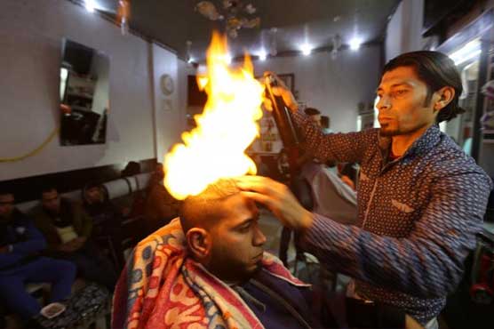 Hottest cut of all - Gaza barber wields blowtorch