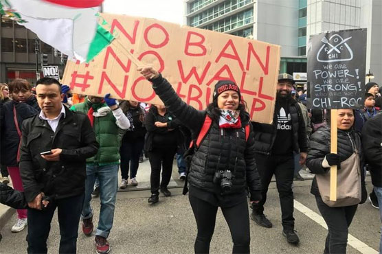 Anti-Trump energy flags during a second day of protests