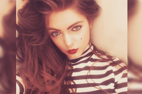 Woman says she was fired for being too pretty