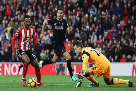 Liverpool drop two points as Defoe scores brace for Sunderland