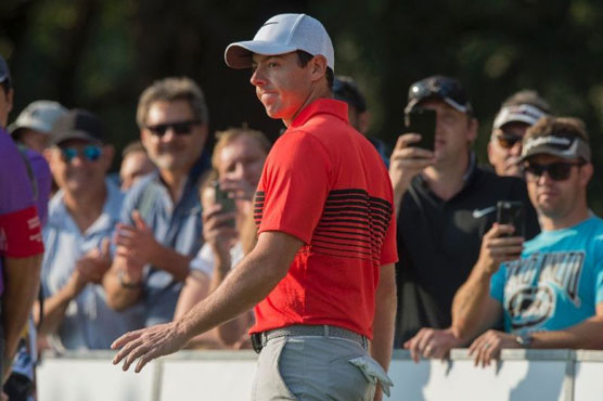 Golf: McIlroy defies back pain to stay in SA Open hunt