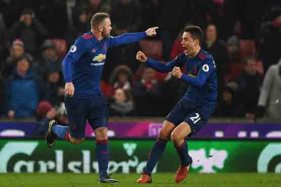 Football: Rooney salvages point with record-breaking strike