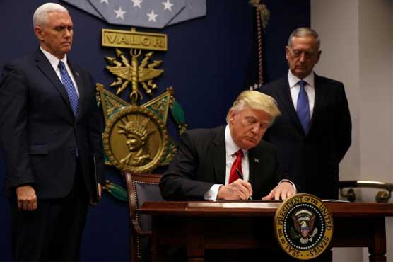 Trump bars visitors from Syria, six other Muslim-majority countries