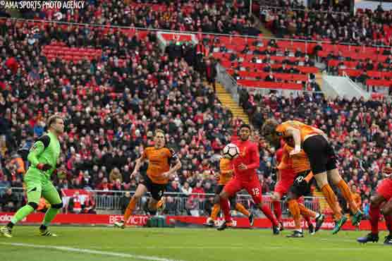 Football: Liverpool out of FA Cup, Spurs survive Wycombe scare