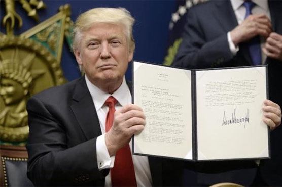 Judge blocks part of Trump's immigration ban for those in US