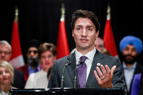 Canada's Trudeau welcomes refugees; U.S.-bound passengers turned away