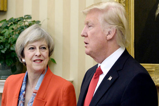 Britain wins exemption on Trump visa ban as PM faces criticism