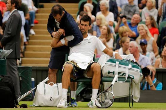 Elbow injury forces Djokovic to quit Wimbledon quarter-final