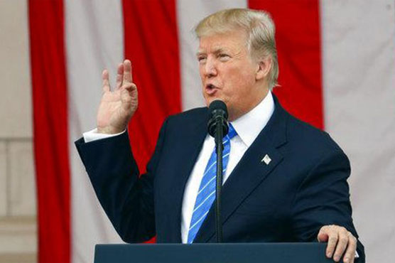 Trump back on offensive after brief respite in Paris