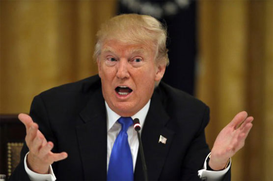 Trump lashes out as presidency hits six-month mark