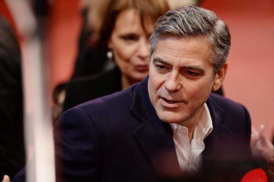 Clooney to sue Voici over images of twins
