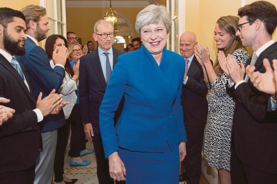 Theresa May vows to stay on election blow