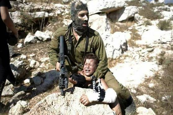 VIDEO: Israeli soldier assaults Palestinian kids