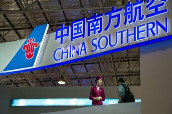 Chinese passenger throws coins at plane for luck