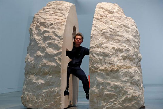 'I'm a little dazed,' French artist says after living in a rock