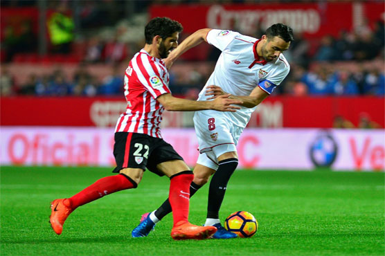 Football: Sevilla maintain chase of Barca, Real Madrid