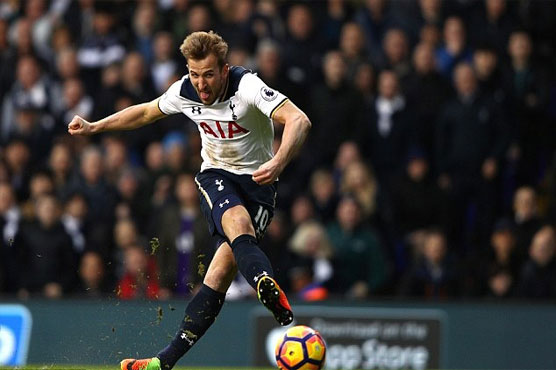 Football: Kane double keeps Spurs in title hunt