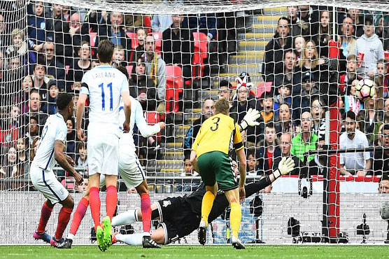 Football: Defoe marks comeback as England toil to win