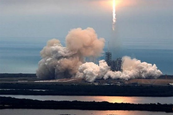 SpaceX hails 'revolution' after recycled rocket launch, landing